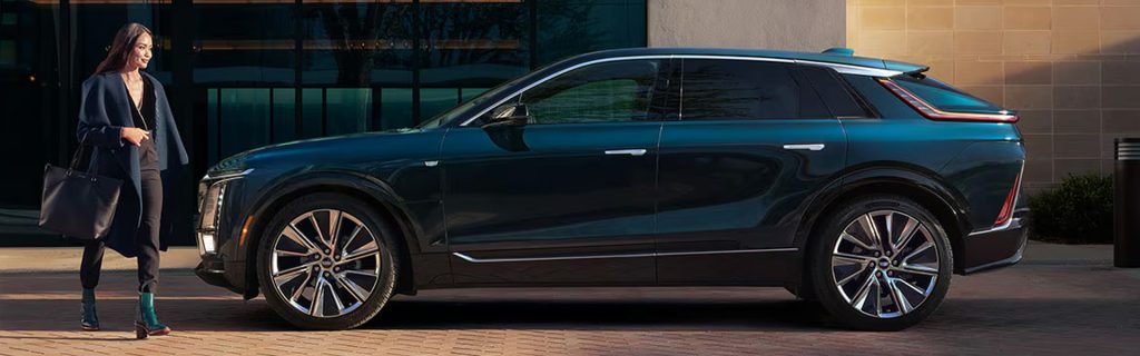 2026 Cadillac Lyriq all-electric SUV showcased in a modern city setting, emphasizing sophisticated design, premium comfort, and advanced EV technology.