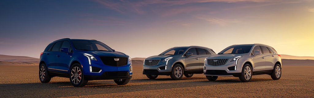 2026 Cadillac XT5 midsize luxury SUVs displayed at sunset, emphasizing premium comfort, advanced safety technology, and versatile performance.